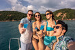 © Kawee - Group of diverse friends drink champagne while having a party in yacht.