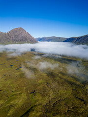 Sticker - Aerial view of low cloud and fog in a valley just after dawn (Glencoe, Scottish Highlands)