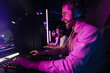 © Drobot Dean - Team of cheerful gamers playing online video game in cybersport club