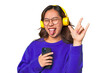 Joyful Asian woman wearing headphones, enjoying music and having fun