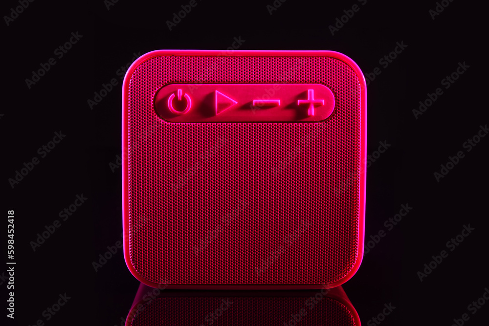 Modern wireless speaker on black background