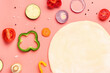 © Pixel-Shot - Raw dough and ingredients for preparing vegetable pie on pink background