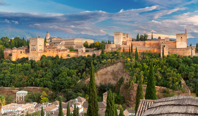 Wall Mural - Granada. Fortress wall with towers in the ancient palace complex of the Alhambra.