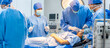 © Kawee - Professional doctors performing surgical operation in operating room.