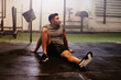 © Flamingo Images - Young man looking tired after working out at the gym