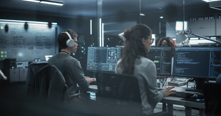 Team of Talented Young Professionals Working in a Technological Research and Development Agency. Computer Screens with Software Code and Technical Neural Network Diagrams