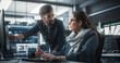 © Gorodenkoff - Two Diverse Multiethnic Indian Colleagues Having a Conversation While Busy Working on a Software Development Project. Female Engneer Talking with a Project Manager. Teamwork in Technology Laboratory