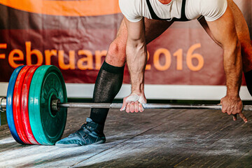 Wall Mural - exercise deadlift powerlifting competition, male athlete powerlifter and barbell with plates