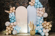 Wedding reception. Arch on background balloons, party decor. Photo-wall decoration space or place with beige, brown and blue balloons. Trendy autumn decor. Celebration baptism concept. Birthday party.