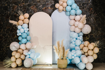 Wall Mural - Wedding reception. Arch on background balloons, party decor. Photo-wall decoration space or place with beige, brown and blue balloons. Trendy autumn decor. Celebration baptism concept. Birthday party.