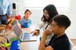 © AntonioDiaz - Smart group of teens learning coding at school