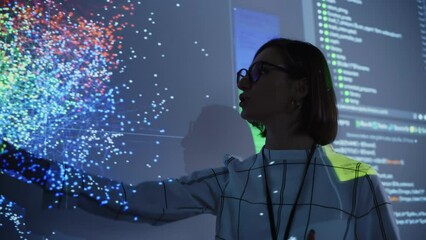 Fototapete - Young Female Teacher Giving a Data Science Presentation in a Dark Auditorium with Projecting Slideshow with Artificial Intelligence Neural Network Architecture. Business Startup and Education Concept