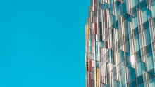A modern skyscraper set against a blue sky