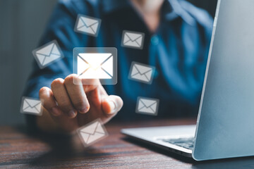 email marketing concept, receive new message, message online chat social text, female hand working with virtual postal envelopes sketch on blurred office background, customer support hotline people.