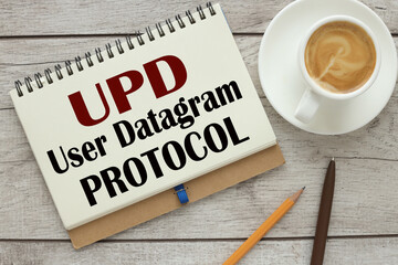 UDP User Datagram Protocol - text on open notebook near pencil and pen