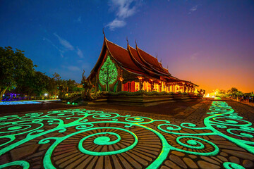 Wall Mural - Sirindhorn Wararam Phu Prao is public Temple (Wat Phu Prao) at night ,It will appear green, blue glow in the night at Sirindhorn district of Ubonratchathani Thailand. Amazing temple in evening, Asia