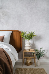 Wall Mural - apartment with stylish decor and green eucalyptus branch in ceramic vase