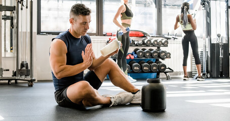 Poster - Strong man making protein cocktail in gym