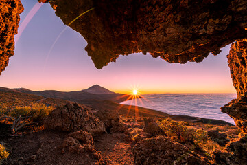 Sunset at Mirador de la Tarta, with view on the Teide volcano and low clouds, on Tenerife, Spain 