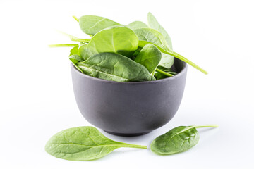 Wall Mural - Green spinach on a white background