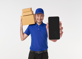 Asian delivery man showing smartphone application and holding parcel box isolated on white background. express shopping online delivery concept.