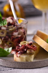 Wall Mural - mediterranean salad appetizer of octopus with olives