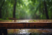 Empty Wooden Table In The Rainy Tropical Forest With Blurred Background