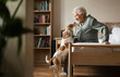 © Halfpoint - Senior woman enjoying time with her little dog.
