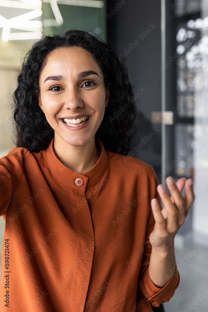 Vertical shot, video call from office hispanic business woman working ...
