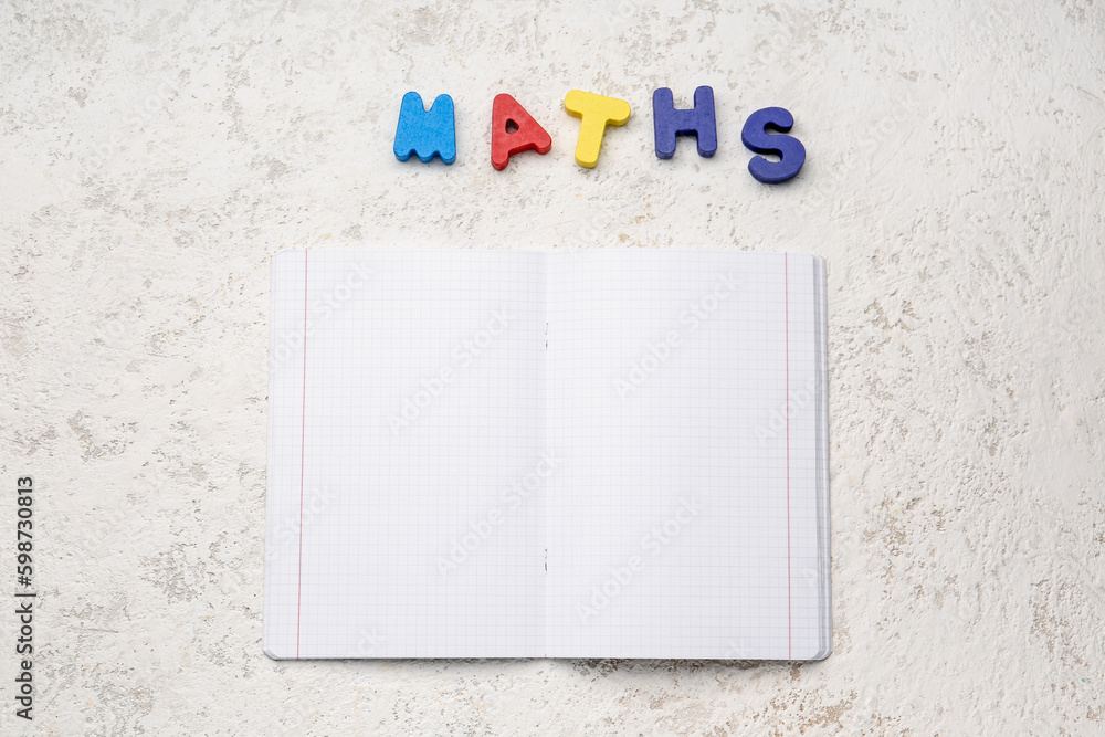 Blank copybook pages and text MATHS on white grunge background
