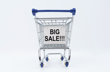 Wall Mural - On a white background is a shopping cart with a sign that says - BIG SALE