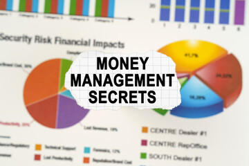 Wall Mural - On diagrams and graphs lies torn paper with the inscription - Money Management Secrets