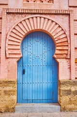 Wall Mural - The horseshoe arch and vintage wooden door of Gran Teatro Falla theatre, Cadiz, Spain