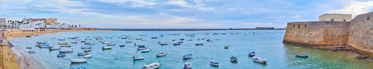 Poster - Panorama of La Caleta beach and moored boats, Costa de la Luz, Cadiz, Spain