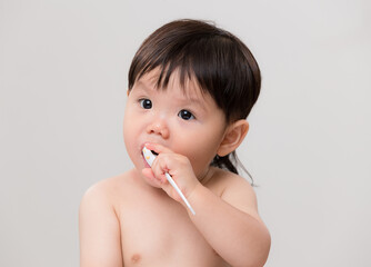 Poster - Asian cute baby boy eat his meal with spoon