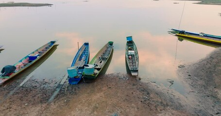 Wall Mural - Cinematic footage Top-view Landscape beach lake fishing boat sunset sky Aerial view 