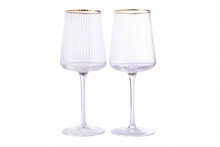 Two Empty Corrugated Wine Glass With Gold Rim