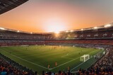 Fototapeta Sport - Soccer players in action on sunset stadium background panorama