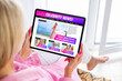 © Kaspars Grinvalds - Woman reading gossip news about celebrities, fashion and entertainment