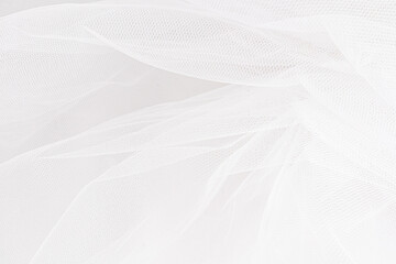 Delicate texture of the background. Elegant soft tulle fabric. Bridal wedding foil close-up for design, plase for text.