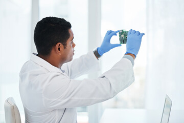 Wall Mural - whatevers wrong, hell make it right. a young man repairing computer hardware in a laboratory.