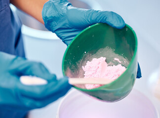 Sticker - The highest quality products only. a dentist mixing a bowl of powder before a procedure.