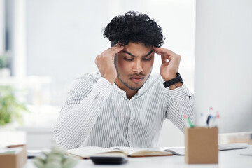 Wall Mural - I just cant make any sense of this. a young businessman looking stressed out while working in an office.