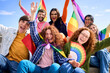Different excited young friends group celebrating gay pride festival day together. Joyful people LGBT community pose funny looking at camera outdoors. Lesbian, gay, transgender 