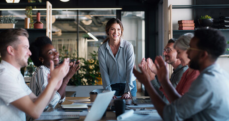 Poster - Growth is a result of everyone working together. a group of businesspeople clapping during a meeting in a modern office.