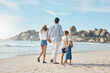 © A. Frank/peopleimages.com - My family will always protect me. Rearview shot of an unrecognizable couple holding hands with their two young children and walking along the beach.