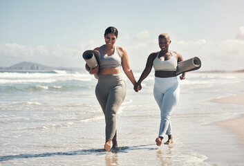 Poster - We dont catch up over coffee, we catch up over yoga. two young women walking on the beach with their yoga mats.