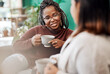 © M Moller/peopleimages.com - Coffee, the official drink of girls night in. two young women having coffee and chatting on the sofa at home.