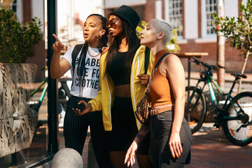 Aufkleber - A shopping date with your friends fixes everything. three close friends spending the day together in the city.