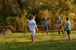 © Flamingo Images - Family playing volleyball outside